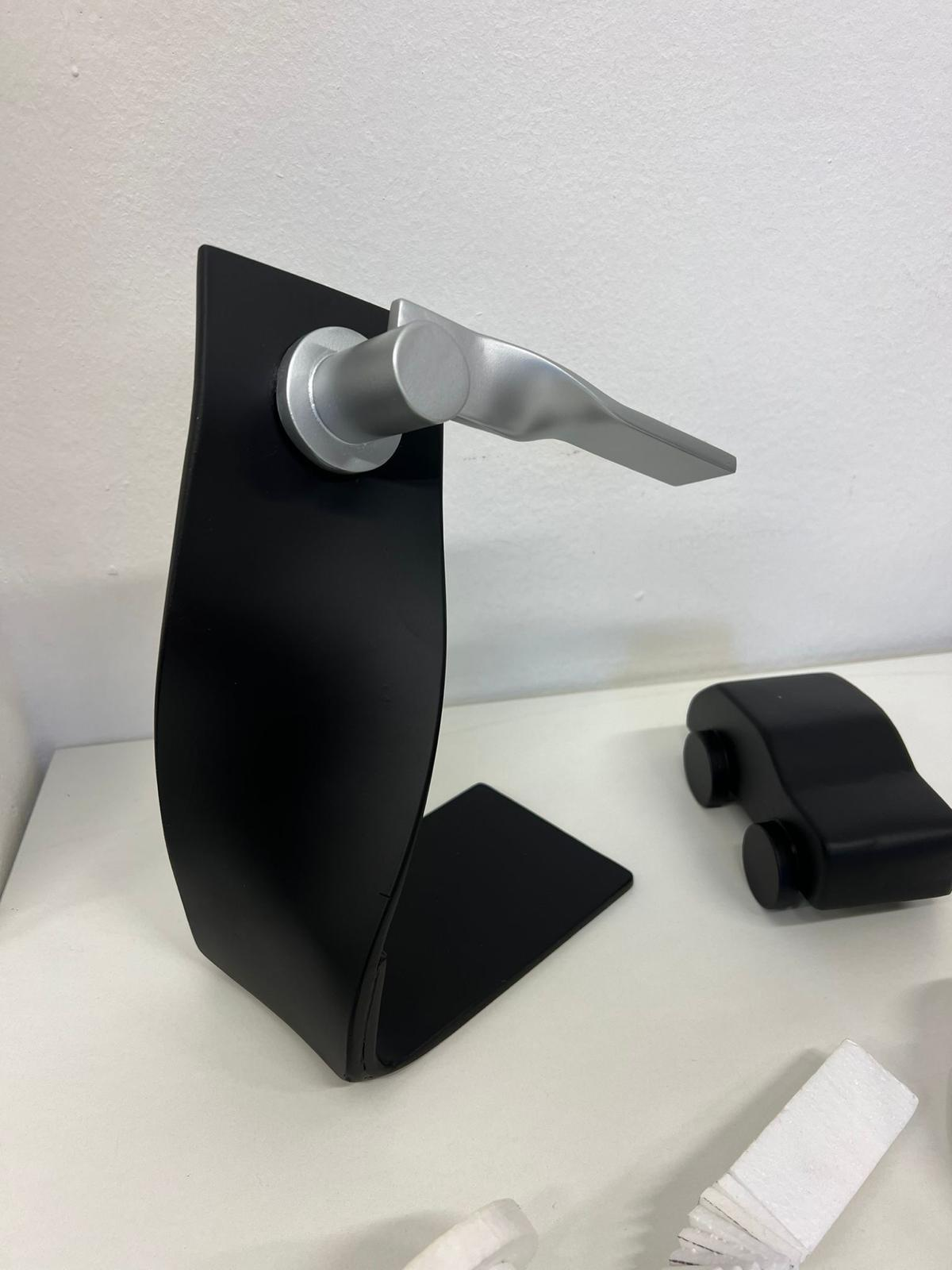 Graphic of a typography specimen showing the alphabet and numerals on top of a dark gray background.